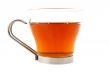 Glass cup of tea with lemon