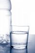 Detail of bottle and glass of mineral water