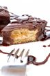 Two chocolate cupcakes with syrup and the fork