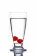 Glass of fresh water with cherries