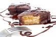 Two chocolate cupcakes with syrup and the fork