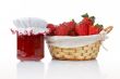 Jam jar and basket of strawberries