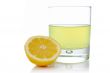 Half and glass of fresh lemon juice