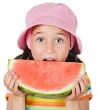 adorable girl eating watermelon
