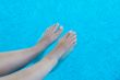 feet refreshing in swimming pool