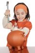adorable girl breaking the money box