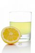 Half and glass of fresh lemon juice