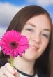 beautiful girl offering a flower