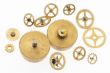 many old gold-coloured little cogwheels