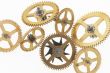 seven old gold-coloured little cogwheels