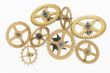 eight old gold-coloured little cogwheels