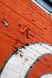 Peeling Red and White Paint