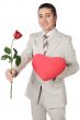 Attractive young man giving a love gift