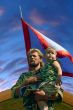 Ukrainian kozak father and son under troop flag