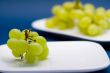 white grapes on a white plate