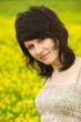 Young woman in yellow flowers