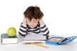 Adorable boy studying