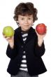 Adorable child with two apples in the hands