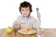 Adorable child hungry at the time of eating