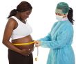 Doctor examining a pregnant woman