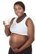 Attractive pregnant woman drinking milk