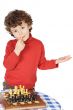 Adorable boy playing the chess