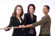 businesswomen pulling together