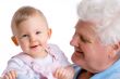 smiling baby with grandfather