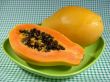 Papayas on green plate