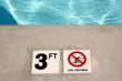 Swimming pool depth marker