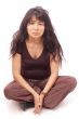 Asian girl sittng cross-legged