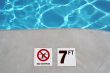 Swimming pool depth marker