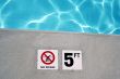 Swimming pool depth marker