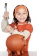 adorable boy breaking the money box