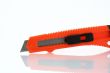 Orange razor knife reflection