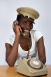 African girl with old phone