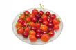 Strawberries, cherries on glass dish, isolated