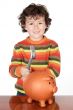 adorable child with money box of piggy