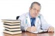 seniors doctor writing