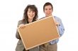 Holding the empty corkboard