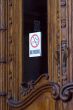 Opening door with no-smoking sign