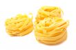 Three uncooked pasta nests