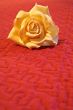 Artificial flower on red background