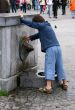 curious kid with fountain
