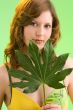 green leaf in her hands