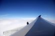 plane wing on a blue day