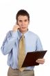 Serious businessman talking with cell phone