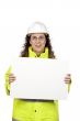 Female construction worker showing a blank banner