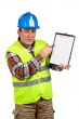 Construction worker showing a blank notebook