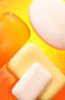 Pieces of soap on a yellow background